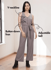 Model wearing taupe v-neck jumpsuit sewing pattern with functional side and back pockets, wide-leg silhouette