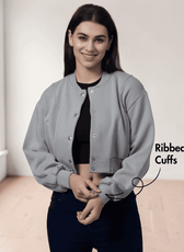 Model wearing a gray bomber jacket with ribbed cuffs, waistband, and front button closure