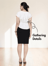 Back view of women's white short sleeve blouse sewing pattern with gathering at back