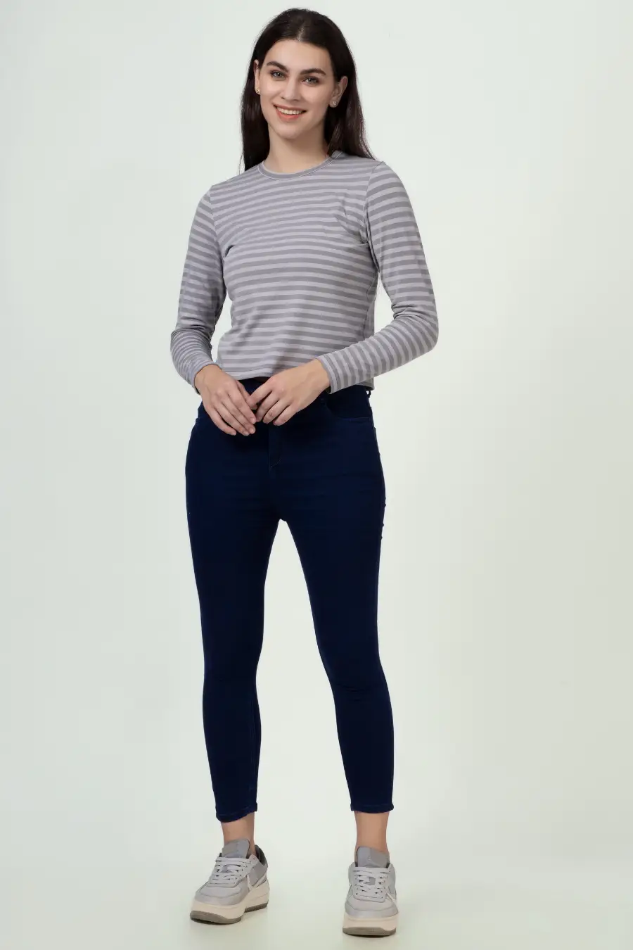 Front view of a model in a striped long sleeve t-shirt sewn from the 'Misha' pattern. A classic round neckline and fitted silhouette for everyday wear.