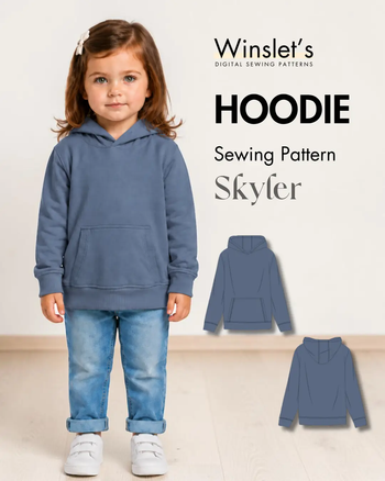 Young girl wearing a blue kids' hoodie with a front kangaroo pocket, ribbed cuffs, waistband, and a cozy hood, perfect for casual wear.