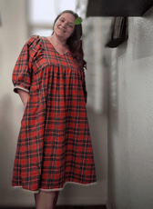 Back view of plaid midi dress with puffed sleeves and gathered waist, Heather sewing pattern