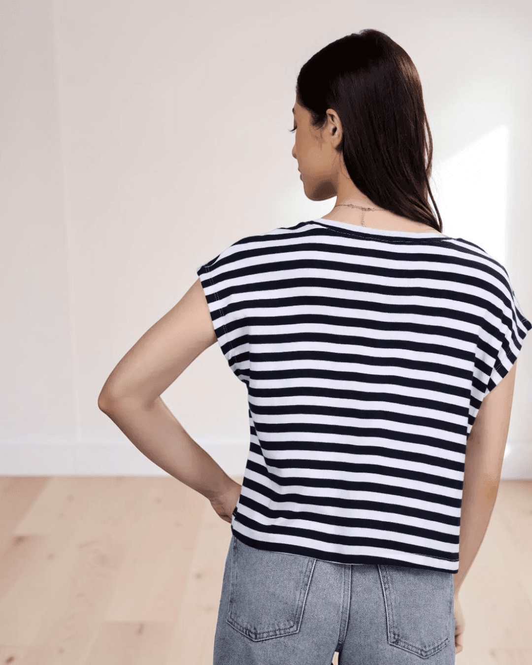 Back view of striped boxy T-shirt with dropped shoulders and relaxed fit, sewing pattern 'Lisa'
