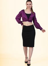 Model wearing the Front Knot Top 'Willow' in purple satin, paired with a black pencil skirt. A chic and versatile sewing pattern for stylish outfits.