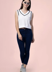 Model wearing the 'Nadine' sweater vest, a sleeveless V-neck top with contrast trim. A stylish and sporty sewing pattern for DIY fashion enthusiasts.