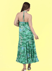 Back view of a green halter neck maxi dress with an open back and tie closure. Sewing pattern available in multiple formats for easy crafting.