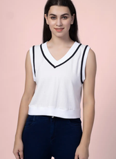 Close-up of the 'Nadine' sweater vest, showcasing its ribbed hem and contrast trim. A versatile sewing pattern for creating a trendy layering piece.