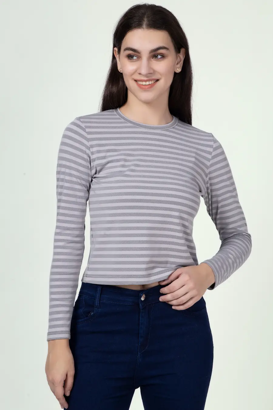 Model posing in a striped long sleeve t-shirt made using the 'Misha' sewing pattern. A versatile and beginner-friendly sewing project.