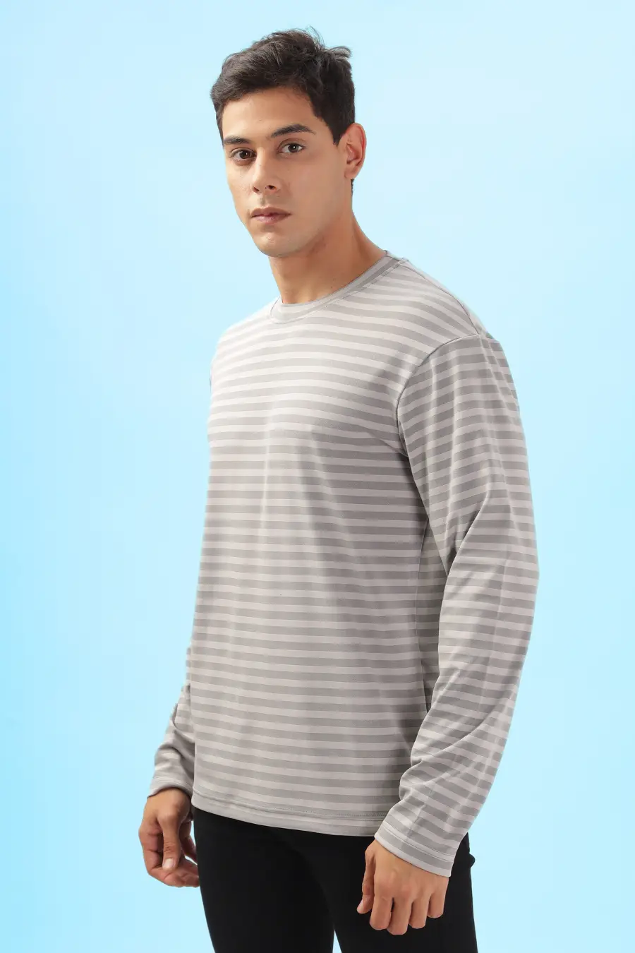 Side view of a men's long sleeve T-shirt made from the 'Maddy' sewing pattern. Designed for casual wear with a relaxed silhouette.