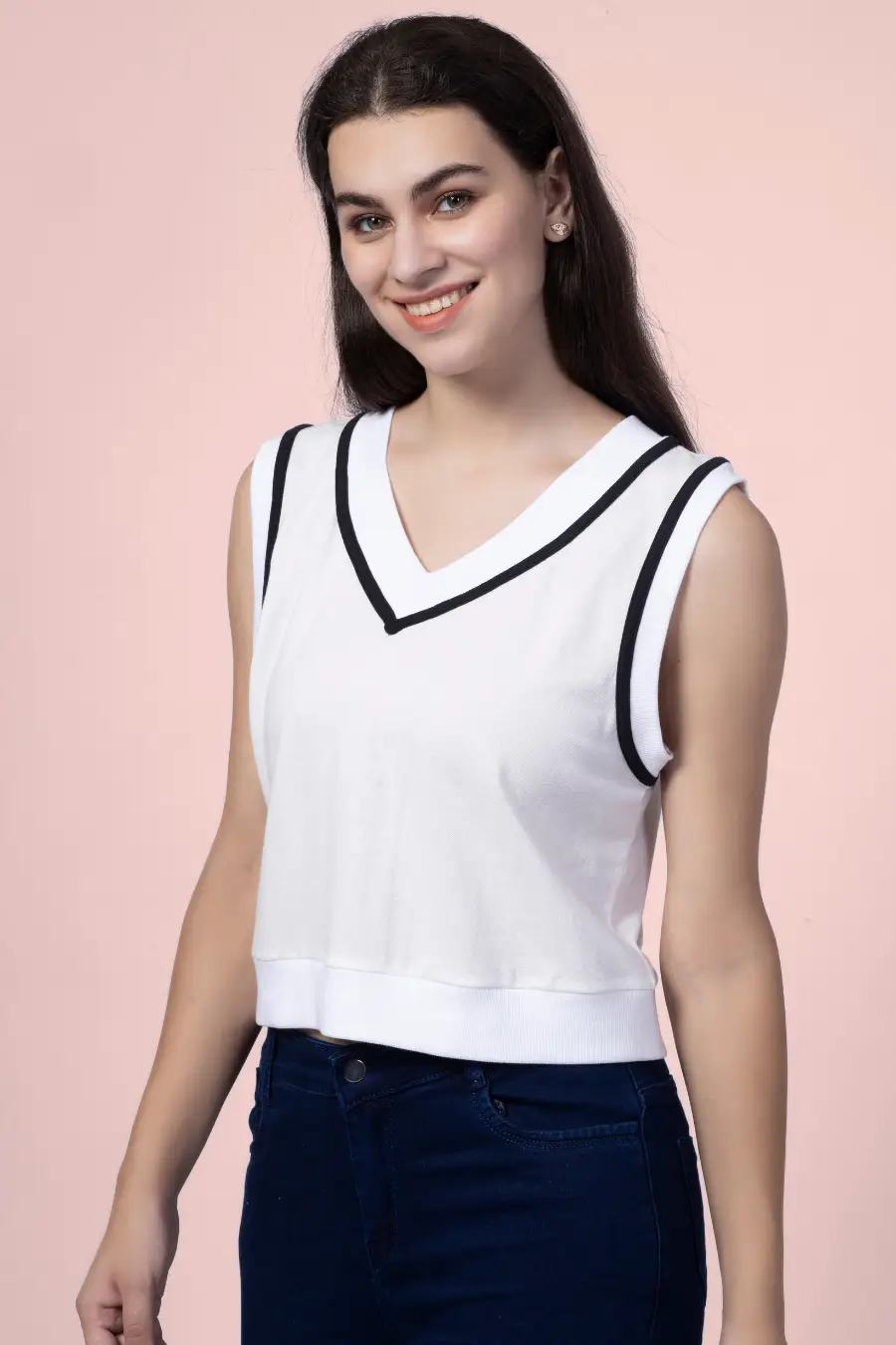 Smiling model wearing the 'Nadine' sweater vest, a chic and comfortable sewing pattern. Ideal for crafting a stylish and sporty wardrobe staple.