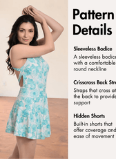 Model wearing blue floral sleeveless swim dress with crisscross back
