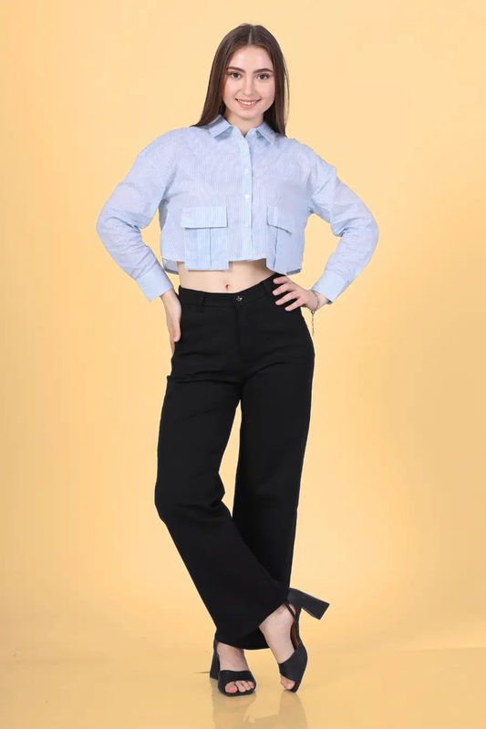 Model wearing the Juniper Utility Shirt, a cropped button-down with structured front pockets. A stylish and functional sewing pattern available in multiple sizes.