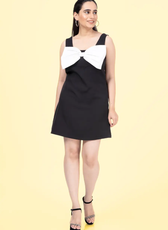 a woman in a black and white dress