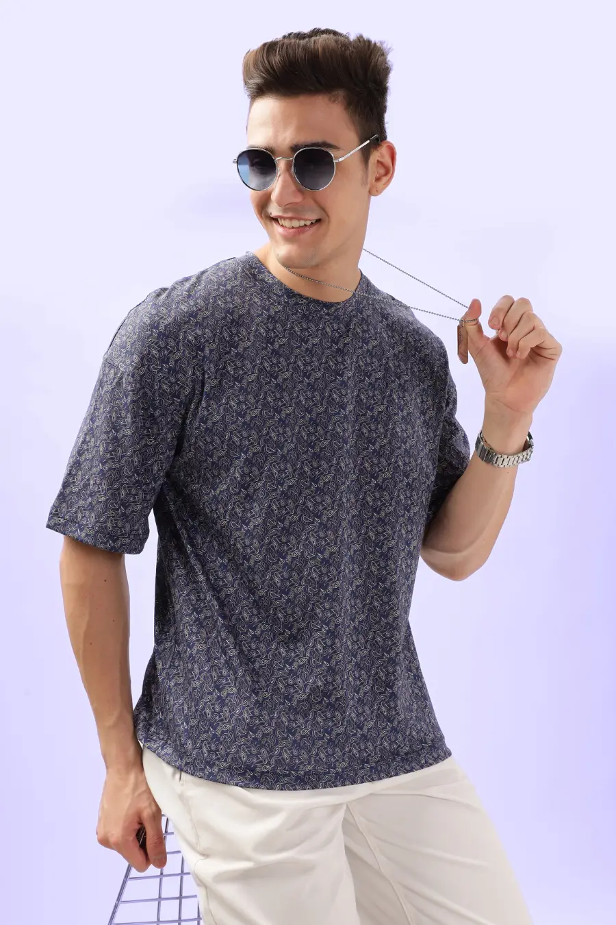 Model wearing the Men's Oversized T-shirt 'Archie' with sunglasses and accessories, showcasing a trendy and effortless casual look.