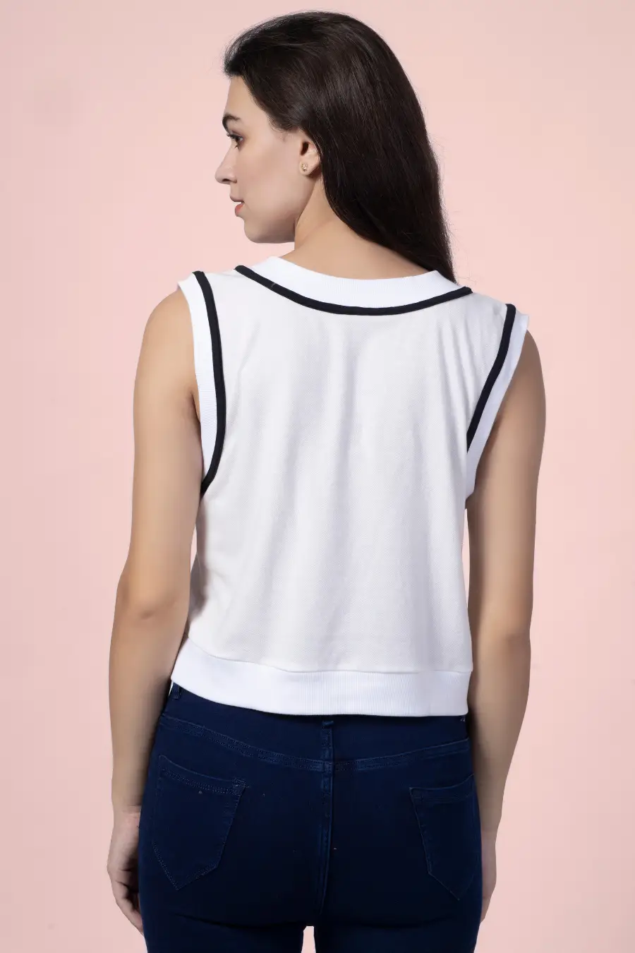 Back view of the 'Nadine' sweater vest, displaying the contrast trim and ribbed hem. A modern and easy-to-sew pattern for fashion lovers.