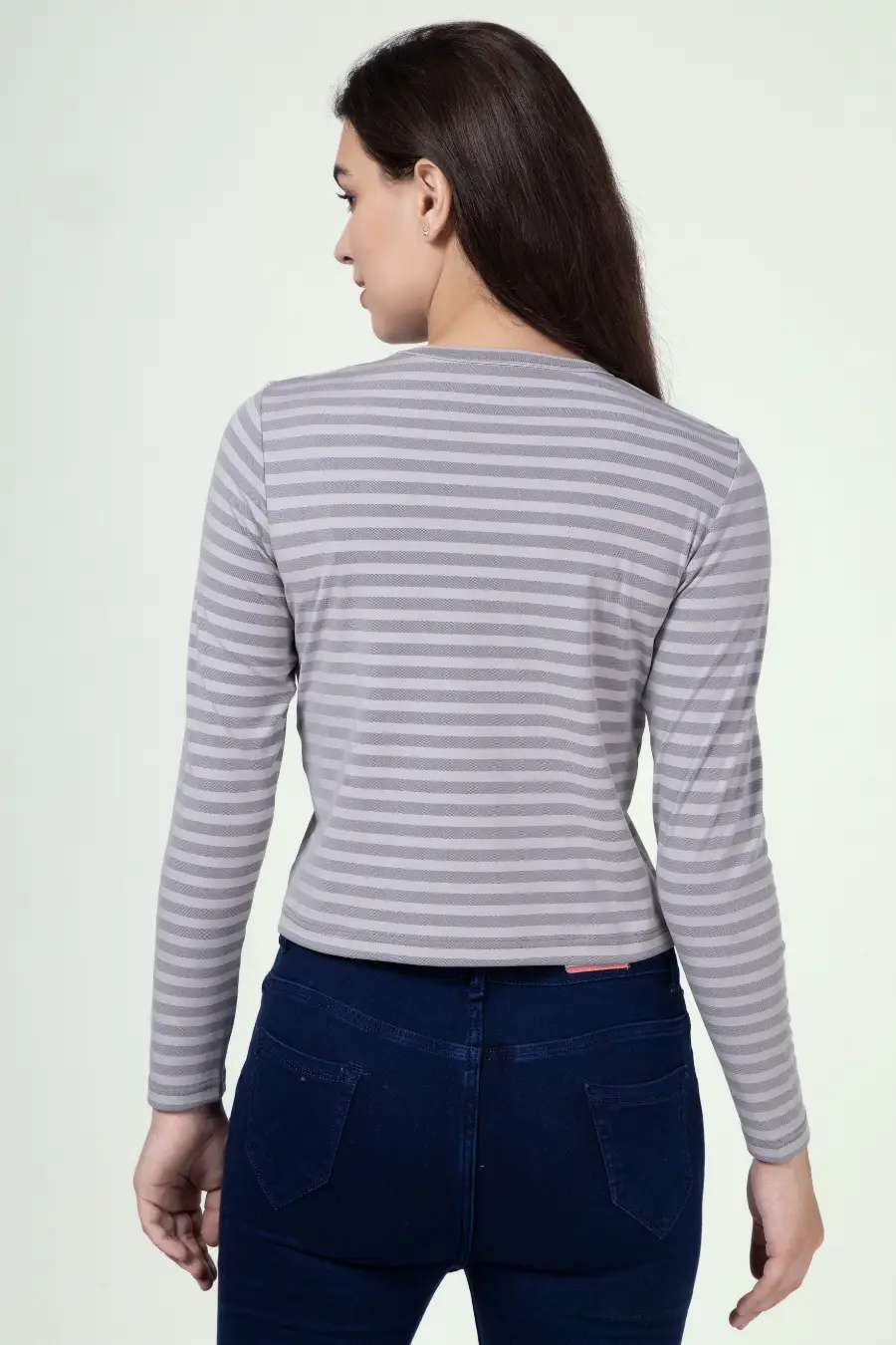 Back view of a model wearing a striped long sleeve t-shirt sewn from the 'Misha' pattern. A simple and elegant design for everyday wear.