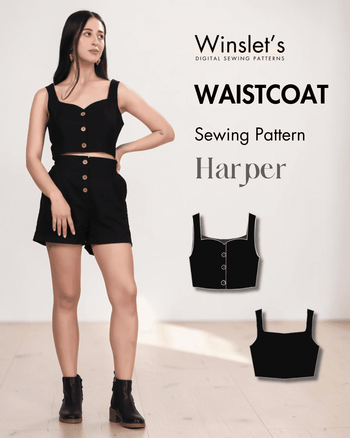 Women's black crop top with sweetheart neckline and button down front, styled with high-waisted shorts