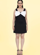 a woman in a black and white dress