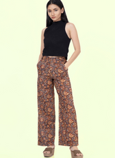 Model wearing Maya wide-leg pants with a high-waisted fit. Stylish and comfortable design, perfect for crafting versatile outfits.
