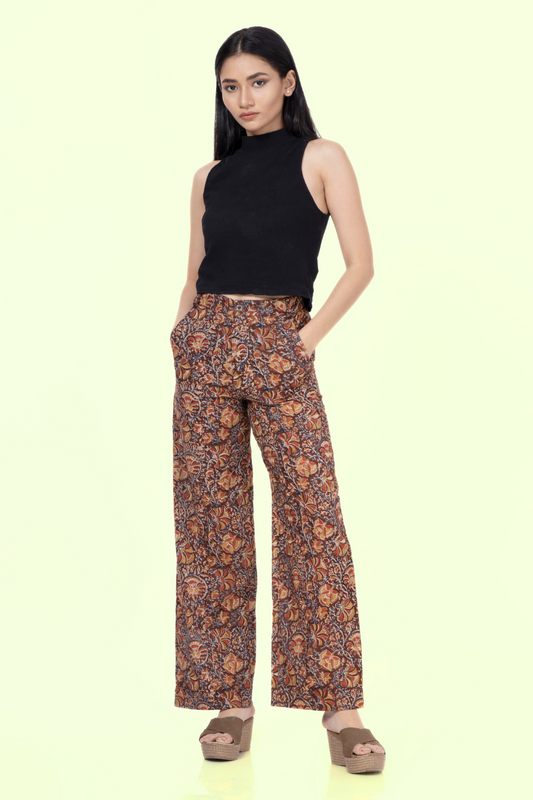 Model wearing Maya wide-leg pants with a high-waisted fit. Stylish and comfortable design, perfect for crafting versatile outfits.