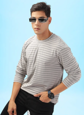 Close-up of a model wearing a men's long sleeve T-shirt made using the 'Maddy' sewing pattern. Soft knit fabric with a comfortable fit.