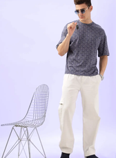 Full-body shot of a model in the Men's Oversized T-shirt 'Archie' paired with relaxed-fit pants, demonstrating a modern and comfortable outfit.