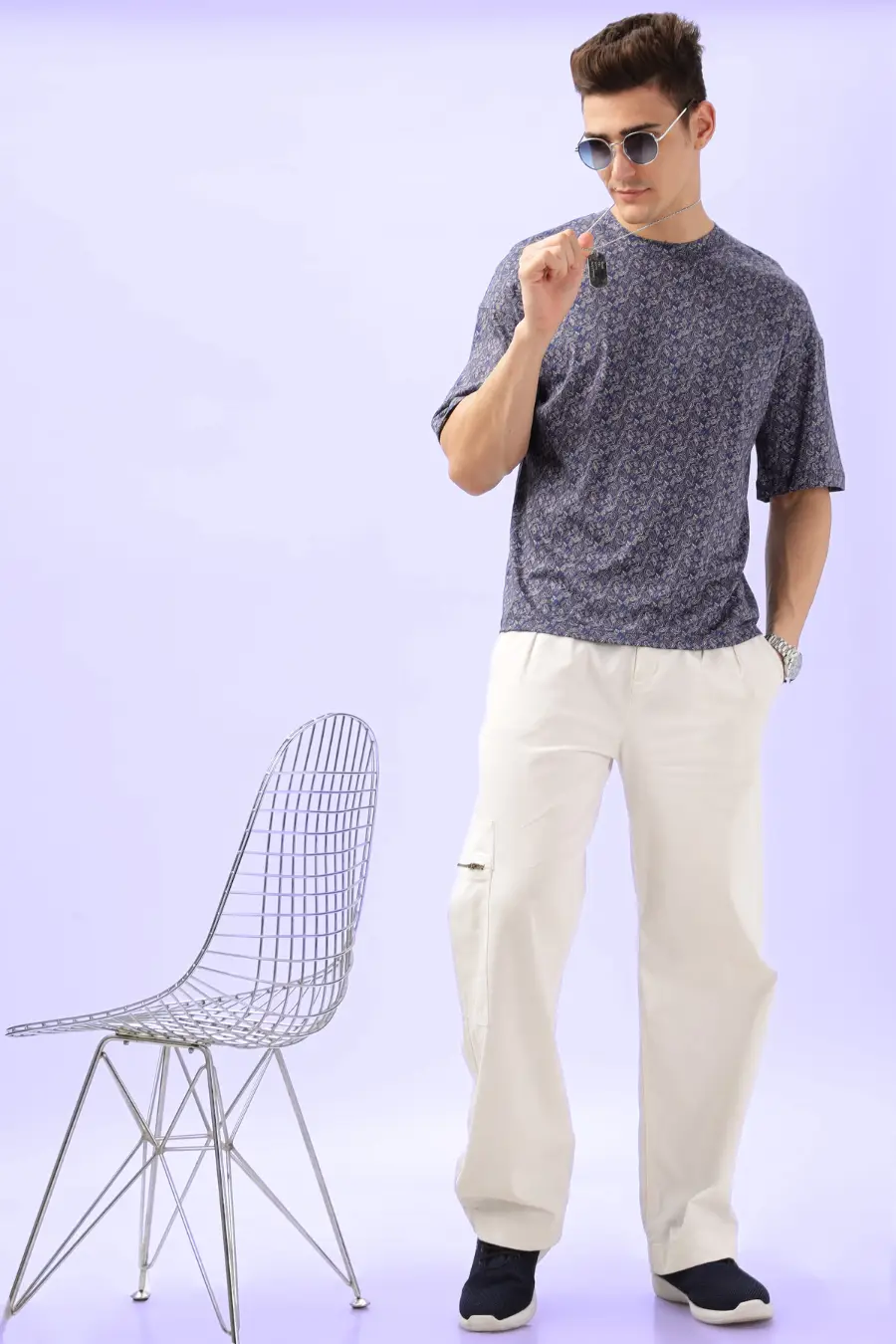 Full-body shot of a model in the Men's Oversized T-shirt 'Archie' paired with relaxed-fit pants, demonstrating a modern and comfortable outfit.