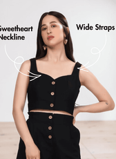 Close-up of black crop top with wide straps, sweetheart neckline, and button front closure