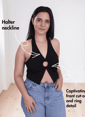 Woman wearing black halter neck crop top with front cut-out and ring detail