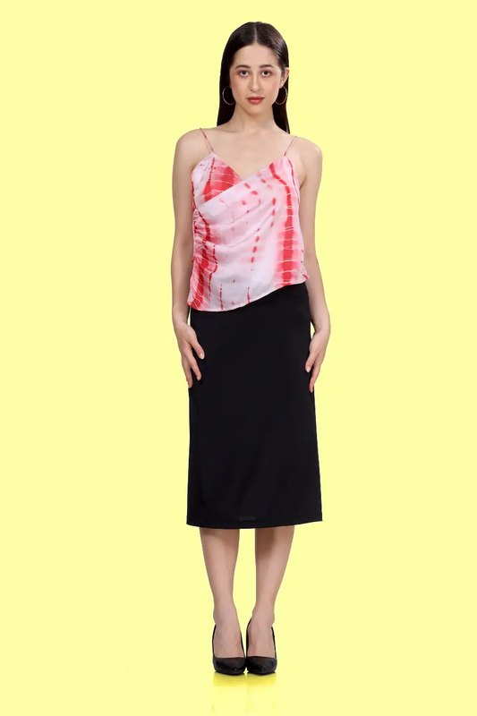 Front view of a model wearing a strappy top with thin straps sewed with winslet's pattern and paired with a black midi skirt