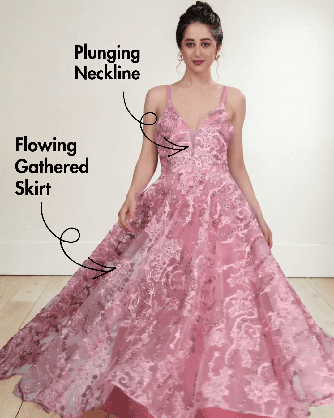 Model wearing pink floral lace evening gown with plunging neckline, flowing gathered skirt, delicate straps, low scoop back