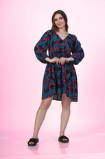 Full length image of a model wearing a V-neck dress highlighting the flowing lantern sleeves