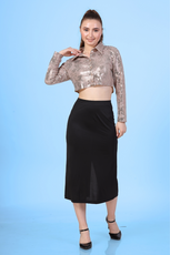 Image of a model wearing a crop shirt with a straight hem and full-length sleeves, paired with a skirt.