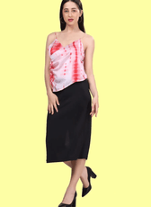 Side view of a model wearing a strappy top with thin straps sewed with winslet's pattern and paired with a black midi skirt