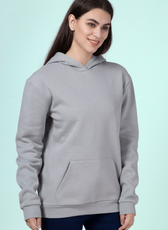 Close-up of a woman wearing a gray hoodie made using the 'Rhea' sewing pattern. Features a kangaroo pocket, ribbed cuffs, and a relaxed fit.