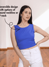 Model wearing blue Ruched Top 'Luna' with V-neckline and side seam ruching, showcasing reversible design