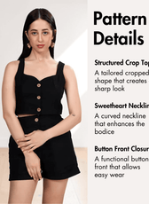 Pattern details of black crop top with structured shape, sweetheart neckline, and button front closure