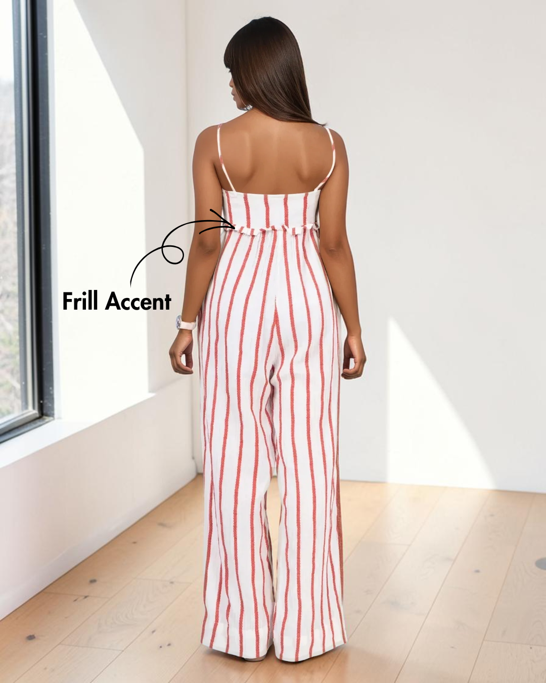 Back view of woman in sleeveless striped jumpsuit with frill detail and wide-leg pants