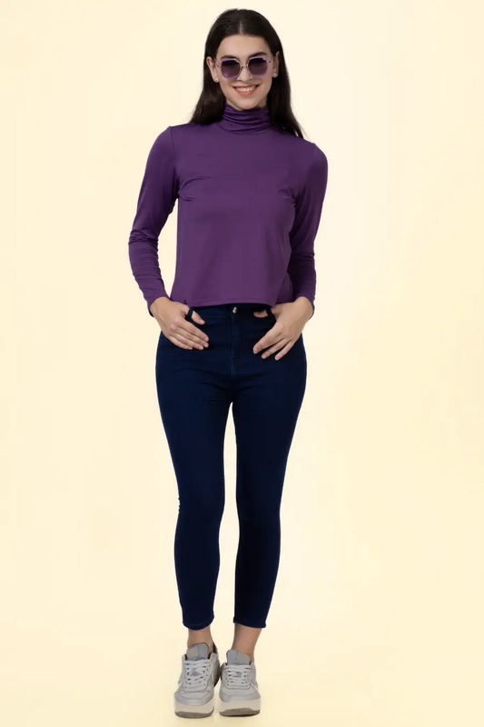 Model wearing a purple turtleneck T-shirt made using the 'Diana' sewing pattern. A fitted long-sleeve design for stylish layering.