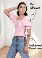Close-up of pink cottagecore top with puff sleeves, ruched bodice, and flared hem