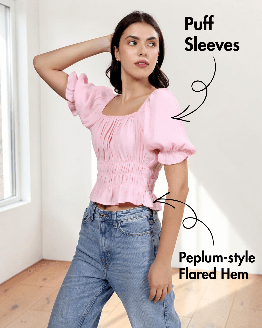 Close-up of pink cottagecore top with puff sleeves, ruched bodice, and flared hem
