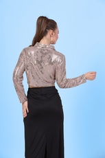 Back view of a model wearing a crop shirt with a straight hem and full-length sleeves sewed with winslet's patterns