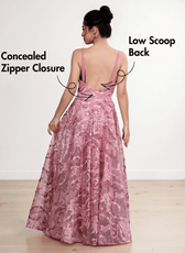 Back view of pink floral lace evening gown with low scoop back, concealed zipper, delicate straps