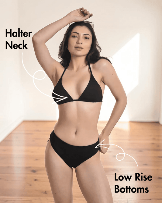 Model wearing black triangle bikini with tie-string straps and low-rise bottoms