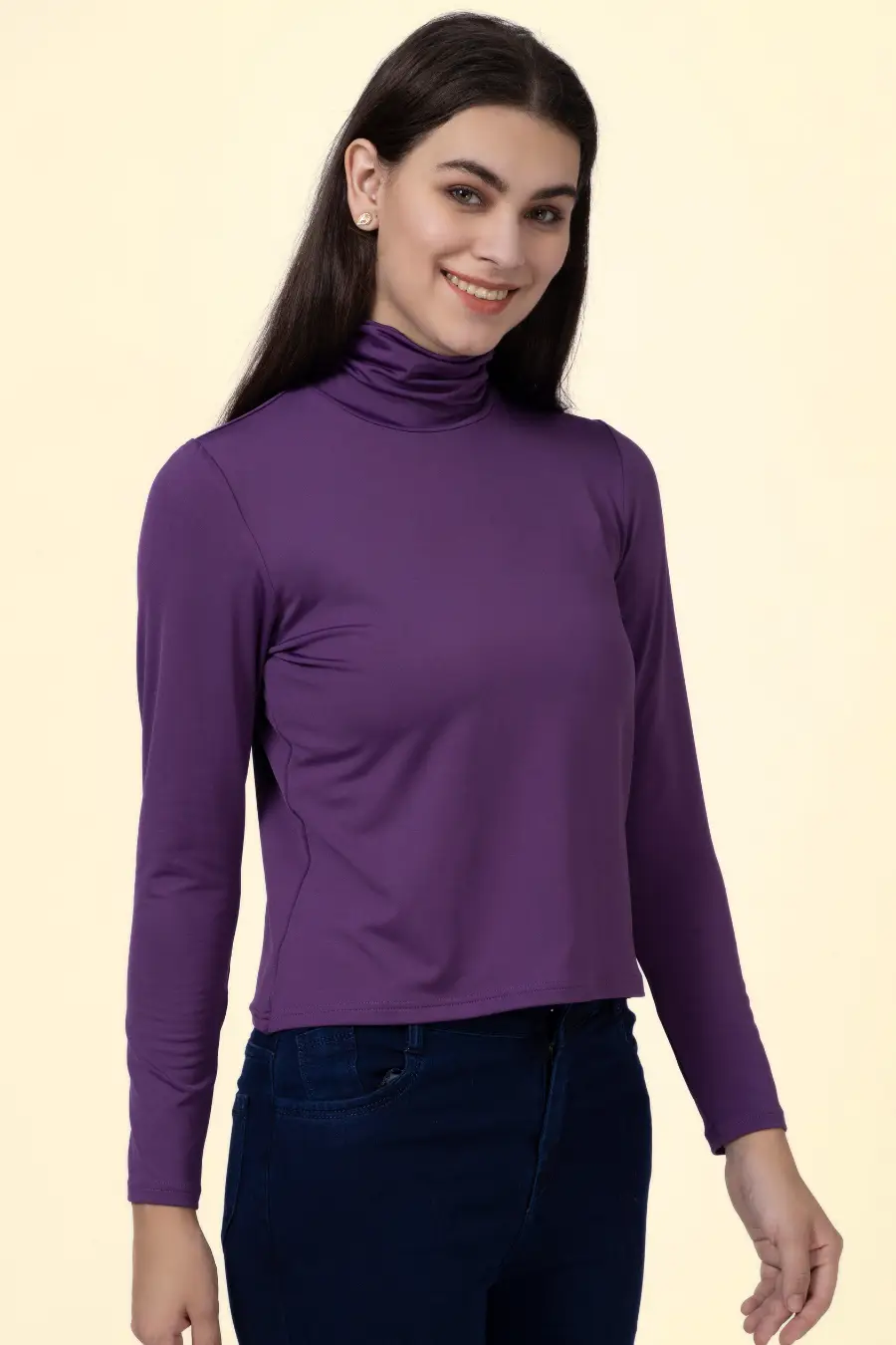 Model smiling in a purple turtleneck T-shirt made from the 'Diana' sewing pattern. A chic and comfortable wardrobe essential.