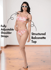 Model wearing pink floral bikini with adjustable straps and Brazilian bottoms