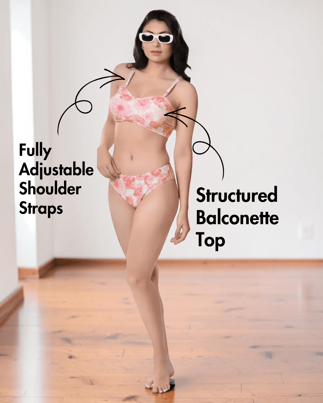 Model wearing pink floral bikini with adjustable straps and Brazilian bottoms