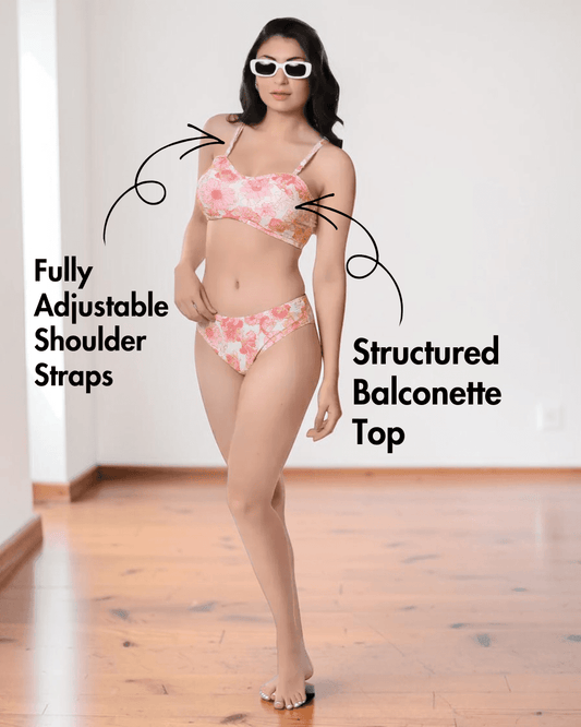 Model wearing pink floral bikini with adjustable straps and Brazilian bottoms