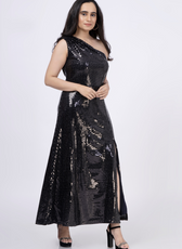 Model wearing a black sequined one-shoulder maxi dress with a thigh-high slit. DIY sewing pattern available in multiple sizes and formats.