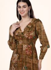 Close-up of the Daisy Maxi Dress highlighting the shirred waist, ruffled V-neckline, and floral fabric. A stylish sewing pattern for dressmakers.